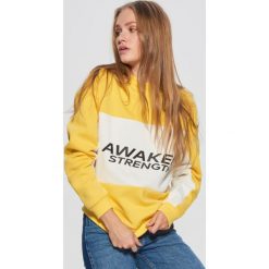 Bluza z napisem - Żółty. Bluzy marki DOMYOS. W wyprzedaży za 59.99 zł.