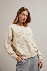 Bluza z aplikacją beżowa. Brązowe bluzy MOODO, s, z aplikacjami, z bawełny, bez ramiączek, bez kaptura. W wyprzedaży za 79.99 zł.