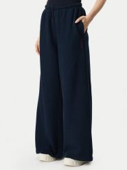 Tommy Jeans Spodnie dresowe Script DW0DW23398 Granatowy Wide Leg. Niebieskie spodnie dresowe Tommy Jeans, bez wzorów, z bawełny. Za 449.99 zł.