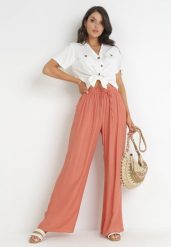 Różowe Brzoskwiniowe Szerokie Spodnie z Wiskozy Zyona. Czerwone jeansy Born2be, bez wzorów, z jeansu, eleganckie. W wyprzedaży za 50.99 zł.