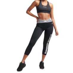 Biustonosz sportowy damski Superdry Core Mid Impact. Białe biustonosze sportowe Superdry, bez wzorów, z elastanu, na fitness i siłownię. Za 112.00 zł.