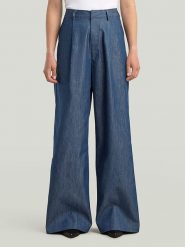 G-Star Spodnie w kolorze granatowym rozmiar: W27. Niebieskie spodnie materiałowe G-Star, bez wzorów, z materiału, retro, z podwyższonym stanem. Za 306.01 zł.