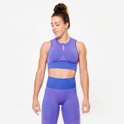 Koszulka fitness damska Domyos crop top bez rękawów. Czerwone topy DOMYOS, m, bez wzorów, z elastanu, sportowe, bez kołnierzyka, bez ramiączek. W wyprzedaży za 69.99 zł.
