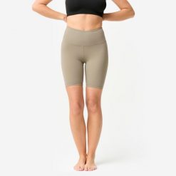 Legginsy krótkie do jogi i pilatesu Domyos. Brązowe legginsy DOMYOS, bez wzorów, z elastanu, sportowe, krótkie. Za 69.99 zł.