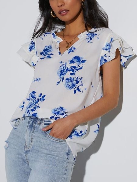 Milan Kiss Bluzka w kolorze biało-niebieskim rozmiar: L. Białe bluzki Milan Kiss, l, bez wzorów, bez kołnierzyka, bez ramiączek. Za 123.25 zł.