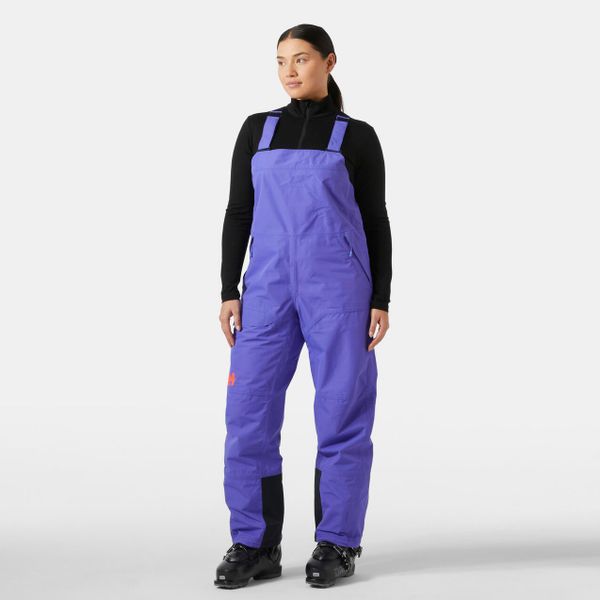 Damski kombinezon narciarski Helly Hansen Emiko Shell Bib. Fioletowe kombinezony Helly Hansen, na zimę, bez wzorów, sportowe, bez kołnierzyka, bez ramiączek. W wyprzedaży za 958.00 zł.