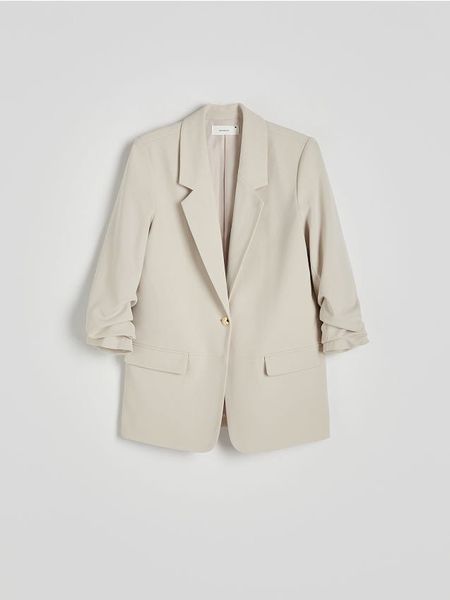 Marynarka z marszczonymi rękawami - beżowy. Brązowe marynarki i żakiety Reserved, l, bez wzorów, z tkaniny, bez ramiączek. W wyprzedaży za 99.99 zł.