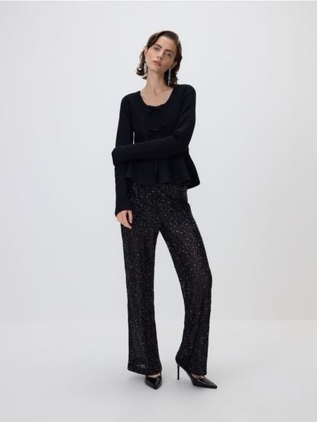 Sweter z kokardkami - czarny. Czarne swetry Reserved, l, bez wzorów, z dzianiny, bez ramiączek. Za 119.99 zł.