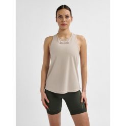 Damski tank top Hummel TE Tola. Szare topy Hummel, m, bez wzorów, z materiału, sportowe, bez kołnierzyka, bez ramiączek. Za 126.50 zł.