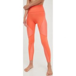 P.E Nation legginsy treningowe Free Play damskie kolor pomarańczowy wzorzyste. Brązowe legginsy P.E Nation, bez wzorów, z materiału. W wyprzedaży za 350.99 zł.