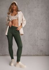 Ciemnozielone Legginsy Basic z Modelującą Wstawką w Pasie Liacan. Zielone legginsy Renee, bez wzorów, z jeansu, casualowe, krótkie. Za 49.99 zł.