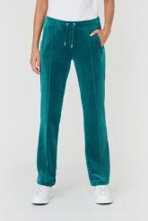 JUICY COUTURE Turkusowe spodnie Tina. Niebieskie spodnie dresowe Juicy Couture, bez wzorów, z dresówki. W wyprzedaży za 299.99 zł.