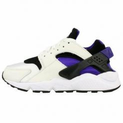 Buty do chodzenia damskie Nike Air Huarache. Białe buty do biegania Nike, bez wzorów, z gumy, bez zapięcia, do biegania. Za 510.45 zł.