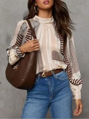 Milan Kiss Bluzka w kolorze kremowo-brązowym rozmiar: M. Brązowe bluzki Milan Kiss, m, bez wzorów, bez kołnierzyka, bez ramiączek. Za 152.99 zł.