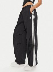 Adidas Spodnie dresowe 3-Stripes Woven Parachute IY7251 Czarny Loose Fit. Czarne spodnie dresowe adidas, bez wzorów, z dresówki. Za 299.99 zł.