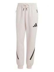 Adidas Spodnie dresowe "Z.N.E." w kolorze kremowym rozmiar: S. Brązowe spodnie dresowe adidas, bez wzorów, z dresówki. Za 156.61 zł.