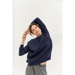 Bluza do jogi Moonholi Cozy AF Oversize Sweatshirt z bawełnianej dzianiny. Czerwone bluzy MOONHOLI, s, bez wzorów, z bawełny, bez kaptura, na fitness i siłownię. Za 429.00 zł.