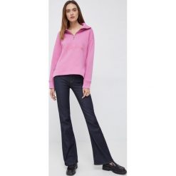 Emporio Armani jeansy damskie. Niebieskie jeansy Emporio Armani, bez wzorów, z jeansu. Za 889.99 zł.