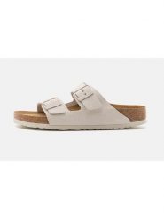 Birkenstock Skórzane klapki "Arizona" w kolorze kremowym rozmiar: 38. Brązowe klapki Birkenstock, bez wzorów, ze skóry, klasyczne, z otwartym noskiem, bez obcasa, bez zapięcia. Za 437.17 zł.