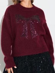 Sweter z cekinową aplikacją w kształcie kokardy i domieszką wełny - różowy. Czerwone swetry Sinsay, l, z aplikacjami, z wełny, bez ramiączek. Za 69.99 zł.