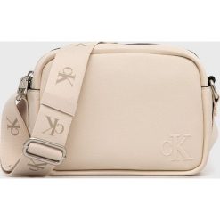 Calvin Klein Jeans torebka kolor beżowy. Brązowe listonoszki Calvin Klein Jeans, bez wzorów, z jeansu, bez dodatków. Za 359.99 zł.