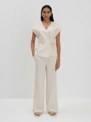 Someday Spodnie "Cevil" w kolorze kremowym rozmiar: 36. Brązowe spodnie materiałowe someday., bez wzorów, z materiału, z podwyższonym stanem. Za 202.50 zł.