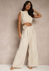 Beżowe Spodnie o Szerokim Kroju High Waist z Kwiatem 3D Firalisse. Brązowe jeansy Renee, l, z aplikacjami, z jeansu, eleganckie, z podwyższonym stanem. W wyprzedaży za 91.99 zł.