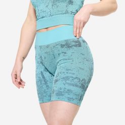 Spodenki fitness damskie Domyos. Fioletowe szorty sportowe DOMYOS, bez wzorów, z materiału, na fitness i siłownię. Za 59.99 zł.