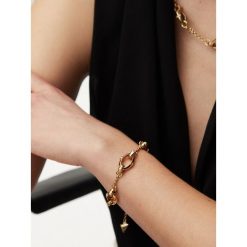 Bransoletka Guess. Żółte bransoletki Guess, złote. Za 219.99 zł.