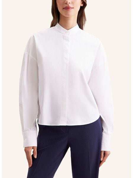 Seidensticker Bluzka w kolorze białym rozmiar: 38. Białe bluzki Seidensticker, bez wzorów, z bawełny, bez kołnierzyka, bez ramiączek. Za 209.33 zł.