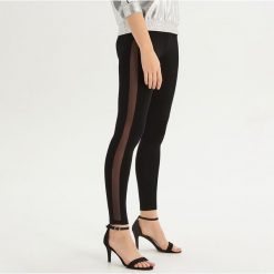 Legginsy z transparentną taśmą - Czarny. Legginsy marki DOMYOS. W wyprzedaży za 19.99 zł.