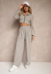 Jasnoszare Spodnie o Szerokim Kroju z Bawełną High Waist Ozdobione Naszywką Naneriela. Szare jeansy Renee, z aplikacjami, z bawełny, eleganckie, z podwyższonym stanem. W wyprzedaży za 41.99 zł.