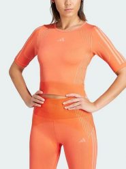 Adidas Koszulka sportowa w kolorze pomarańczowym rozmiar: M. Pomarańczowe t-shirty sportowe adidas, m, bez wzorów, bez ramiączek, outdoorowe. Za 102.89 zł.