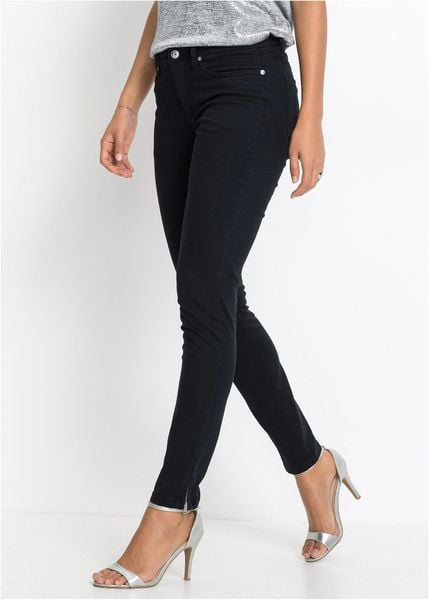 Jeansy skinny, mid waist, cropped. Czarne jeansy bonprix, bez wzorów, z jeansu. Za 124.99 zł.