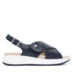 Sandały Caprice. Niebieskie sandały Caprice, bez wzorów, bez obcasa, na płaskiej podeszwie, bez zapięcia. Za 399.99 zł.
