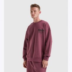 Bluza DIADORA SWEATSHIRT CREW MANIFESTO. Fioletowe bluzy z kapturem Diadora, m, bez wzorów, z bawełny, bez kaptura. Za 139.99 zł.