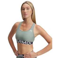 Biustonosz dla kobiet Under Armour HeatGear®. Białe biustonosze sportowe Under Armour, bez wzorów, na fitness i siłownię. Za 186.50 zł.