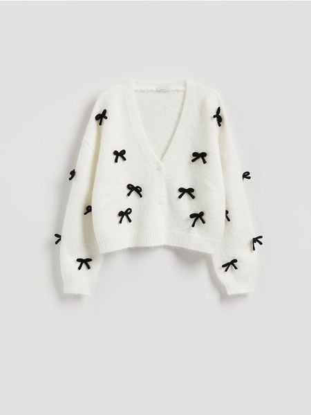 Sweter z kokardami - kremowy. Białe swetry Reserved, l, bez wzorów, z dzianiny, bez ramiączek. Za 149.99 zł.