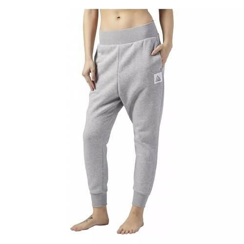 Spodnie sportowe damskie Reebok Workout. Szare spodnie dresowe Reebok, bez wzorów, z dresówki, długie. Za 356.00 zł.
