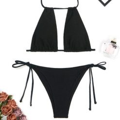 Dwuczęściowy strój kąpielowy z regulowanym topem na plażę lub basen Maribel. Białe bikini Intica, bez wzorów, z materiału. Za 139.00 zł.