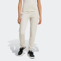 Spodnie dresowe damskie ADIDAS Gym & Pilates. Spodnie dresowe adidas, bez wzorów, z bawełny. Za 179.99 zł.