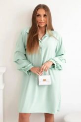 Sukienka oversize z ozdobnym rękawem jasno miętowa. Zielone sukienki Włoski, na co dzień, l, bez wzorów, z elastanu, eleganckie, bez kołnierzyka, bez ramiączek, oversize. Za 133.82 zł.