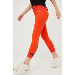Adidas Performance legginsy treningowe Marimekko damskie kolor pomarańczowy wzorzyste. Brązowe legginsy adidas Performance, bez wzorów, z materiału. W wyprzedaży za 234.99 zł.