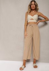 Beżowe Spodnie High Waist z Szerokimi Nogawkami z Wiskozą Wykończone Gumką w Talii Crisantas. Brązowe jeansy Renee, l, bez wzorów, z jeansu, biznesowe, z podwyższonym stanem. W wyprzedaży za 27.99 zł.
