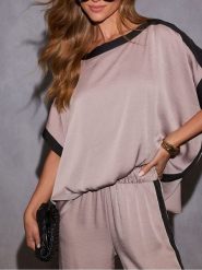 Milan Kiss Bluzka w kolorze jasnoróżowo-czarnym rozmiar: XL. Różowe bluzki Milan Kiss, xl, bez wzorów, bez kołnierzyka, bez ramiączek. Za 130.99 zł.