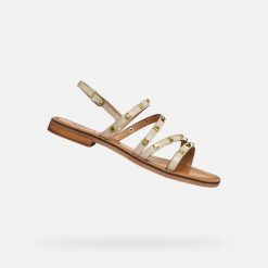 Sandały damskie Geox Maddalusiac. Białe sandały Geox, bez wzorów, z materiału, eleganckie, bez obcasa, na płaskiej podeszwie, bez zapięcia. Za 343.00 zł.