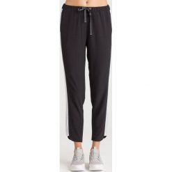 SPODNIE DRESOWE LIU JO SPORT. Czarne spodnie dresowe Liu Jo Sport, z aplikacjami, z dresówki. Za 353.40 zł.