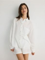 Koszula z bawełnianego muślinu - biały. Białe koszule Reserved, l, bez wzorów, z bawełny, bez kołnierzyka, bez ramiączek. W wyprzedaży za 99.99 zł.