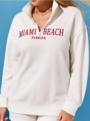 Bluza z haftowanym napisem - kremowy. Białe bluzy Sinsay, l, bez wzorów, bez ramiączek, bez kaptura. Za 49.99 zł.