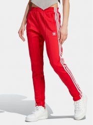Adidas Spodnie dresowe adicolor SST IK6603 Czerwony Slim Fit. Czerwone spodnie dresowe adidas, bez wzorów, z bawełny. Za 189.99 zł.